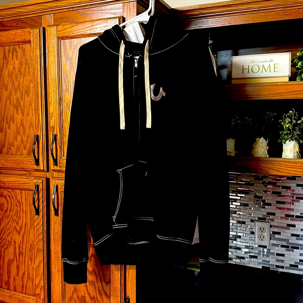 A True Religion zip-up hoodie, size Large, Black & Gray.